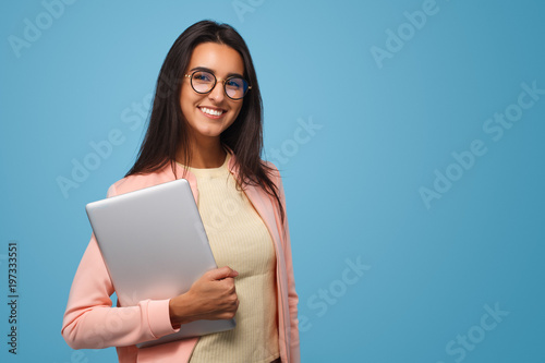 Charming student girl with laptop