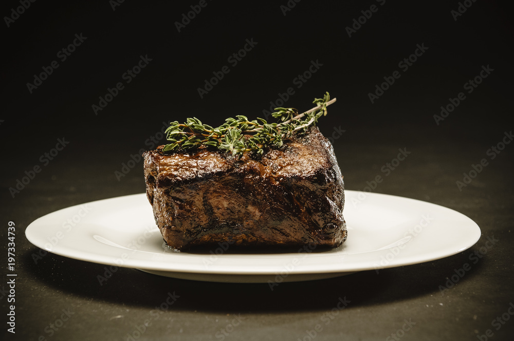 big grilled beef steak with leaf of thyme Stock Photo Adobe Stock
