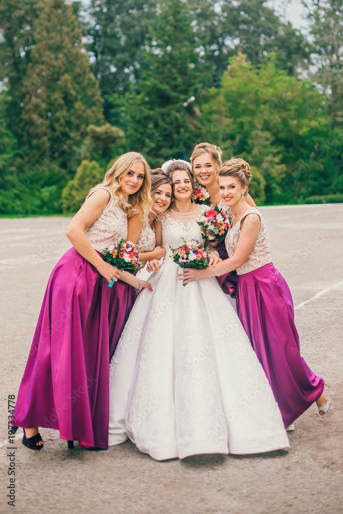 Bride With Bridesmaids On Wedding Day. Bride show bridesmaids her new ring. The girls laugh. Funny wedding moments. Bride With Bridesmaids On Wedding Day. Bride show bridesmaids her new ring. The girls laugh. Funny wedding moments.