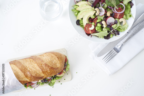 close up of fresh sandwich on plate of wood