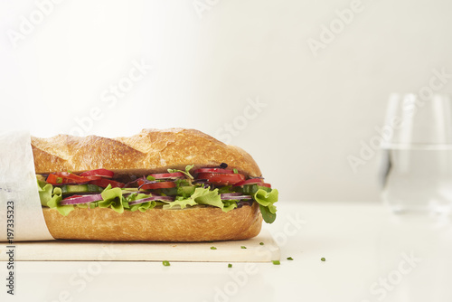 close up of fresh sandwich on plate of wood