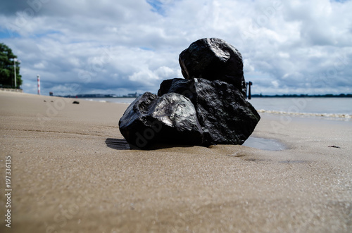 Black Stack of Stone near Beach of Blankenese in Hamburg, Germany