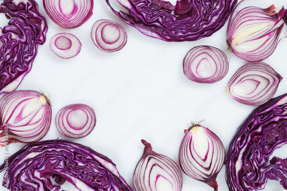 Fototapeta premium Sliced red onion and cabbage on a white background