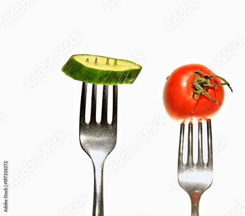 vegetable on fork with cucumber and tomato stock photo