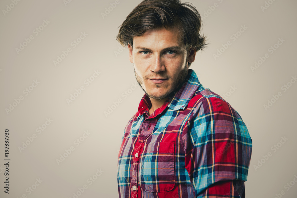 Fototapeta premium caucasian man wearing checkered shirt and trendy hairstyle