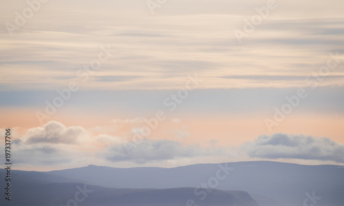 very soft light form of the peaks of mountains and clouds. Lines of repeating natural. Iceland. Relax the view. 