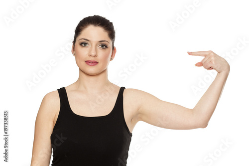 Young beautiful woman pointing at her self on white background photo