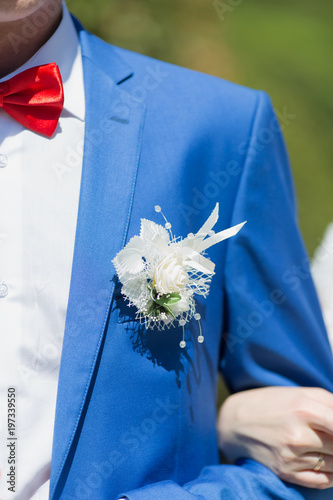 Boutonniere on wedding suit of groom