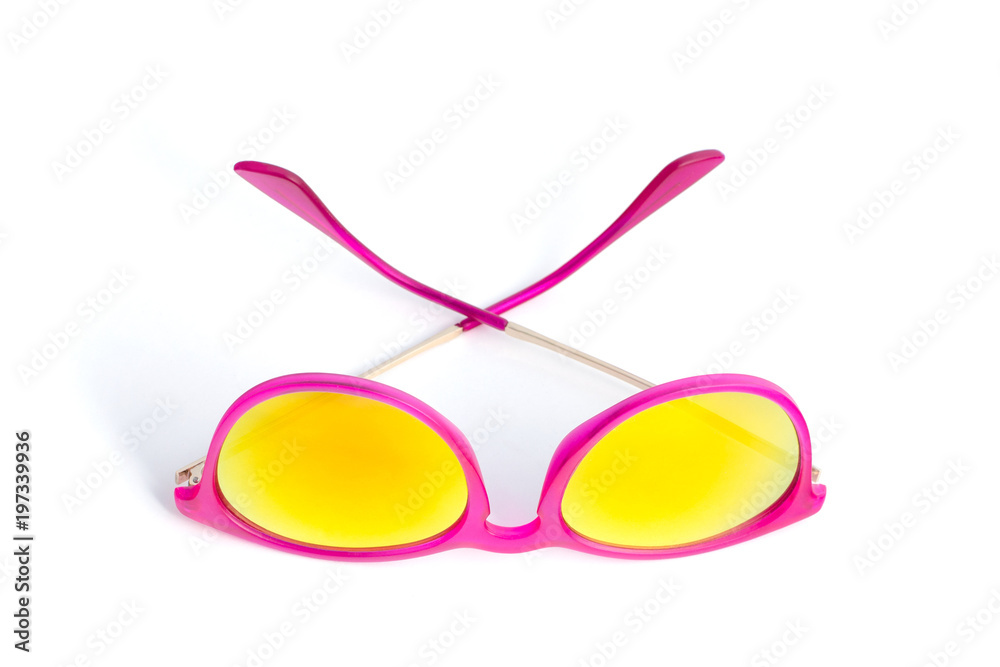 Fototapeta premium Pink sunglasses isolated on white background. The view from the top