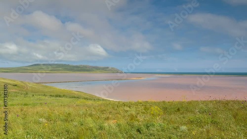 Russia, time lapse. The movement of clouds in the spring in the steppe part of the Crimea peninsula at Cape Opuk.
 photo