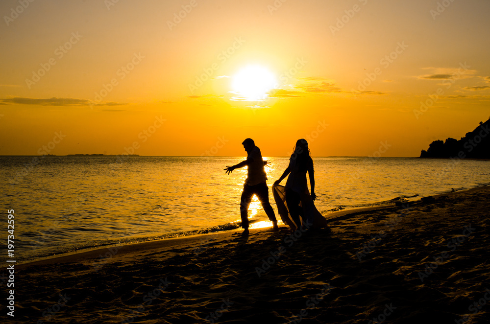 wedding couple in beautiful at sunset by the sea.