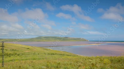 Russia, time lapse. The movement of clouds in the spring in the steppe part of the Crimea peninsula at Cape Opuk.
 photo