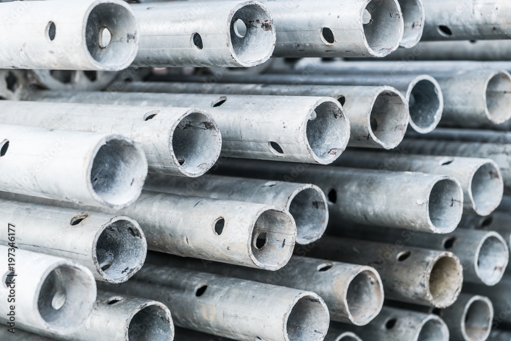 scaffolding steel poles closeup  -  construction industry concept 