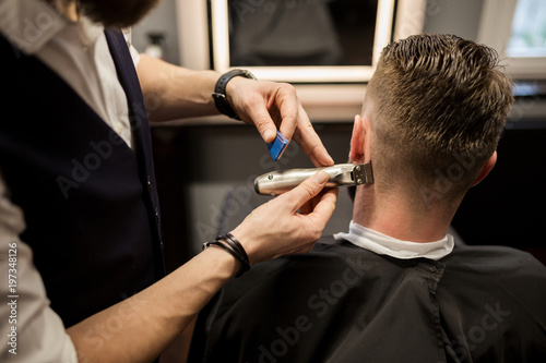 Man being trimmed at barber shop