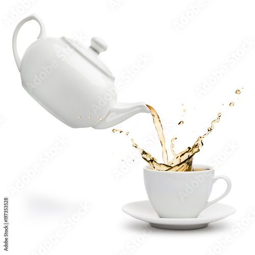 teapot pouring tea into cup on white background