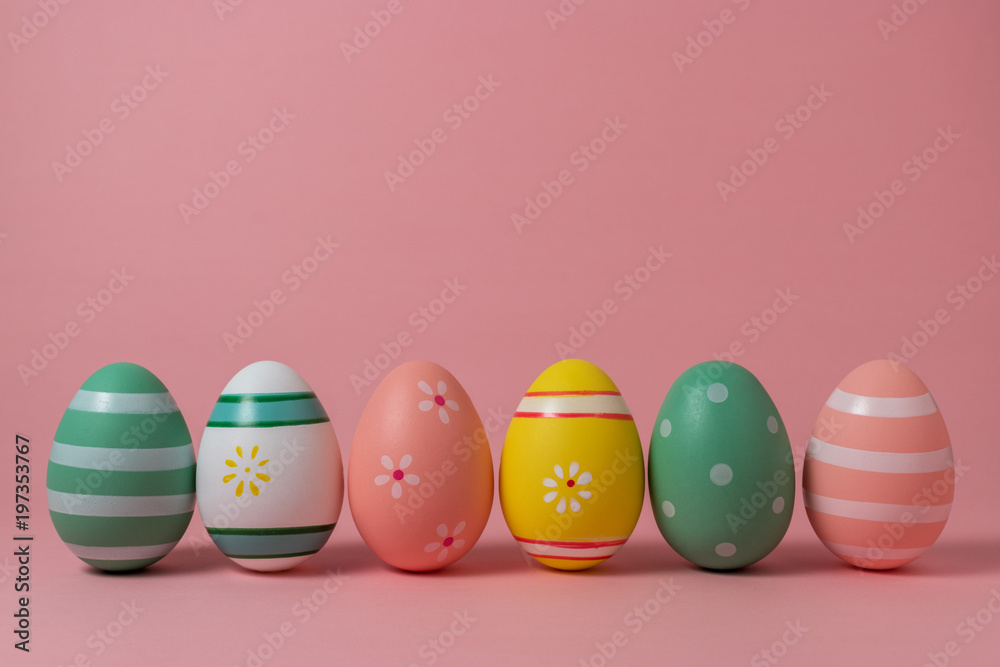 Colorful easter eggs on pink background. Easter concept.