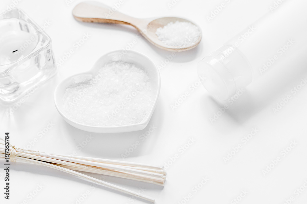 white set of cosmetics for spa on table background white set of cosmetics for spa on table background