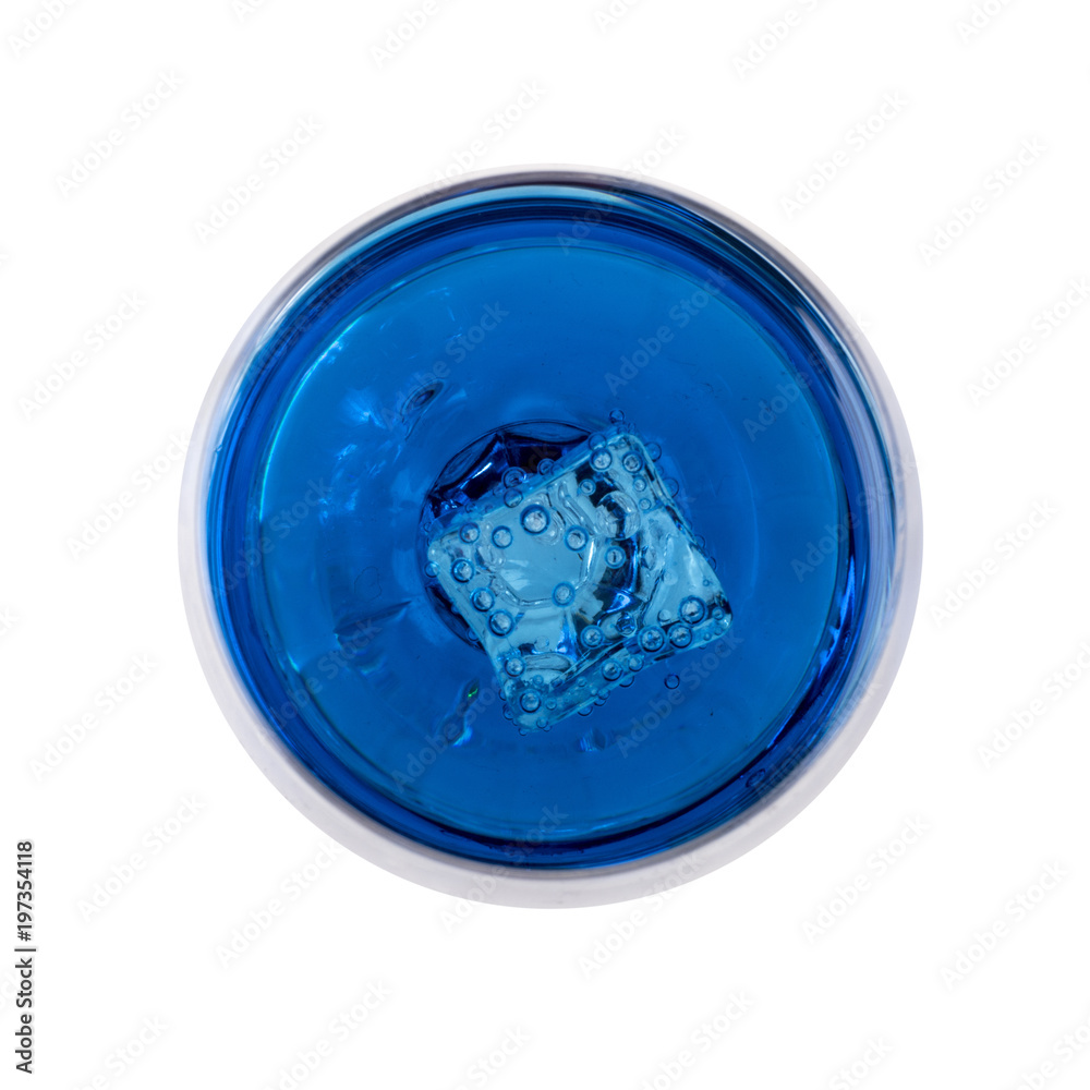 Blue carbonated drink in a glass and ice, close-up on a white background. Blue carbonated drink in a glass and ice, close-up on a white background.