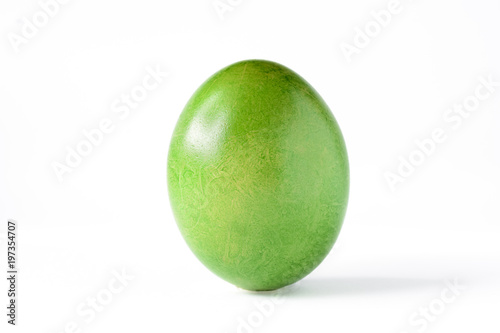 Close up of a green easter egg isolated on white.