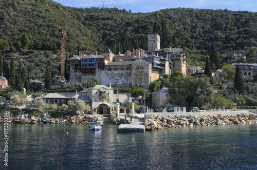 Athos peninsula, Greece. The Monastery of Dochiariou, founded in the 10th century, located in the Monks Republic on the peninsula of Athos. View from a ferry. photo