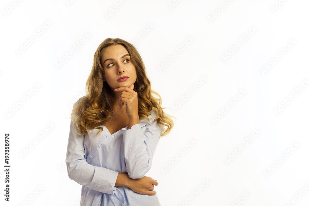 Funny pretty young business woman looking up on copy space over white background Funny pretty young business woman looking up on copy space over white background