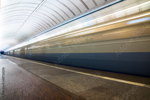 Quadro em tela Subway train in motion arriving at station