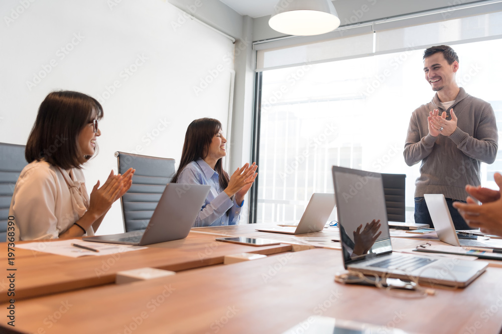 Business people are discussing about their work. Happy boss is talking to employee at workplace. Setup studio shooting. Business people are discussing about their work. Happy boss is talking to employee at workplace. Setup studio shooting.