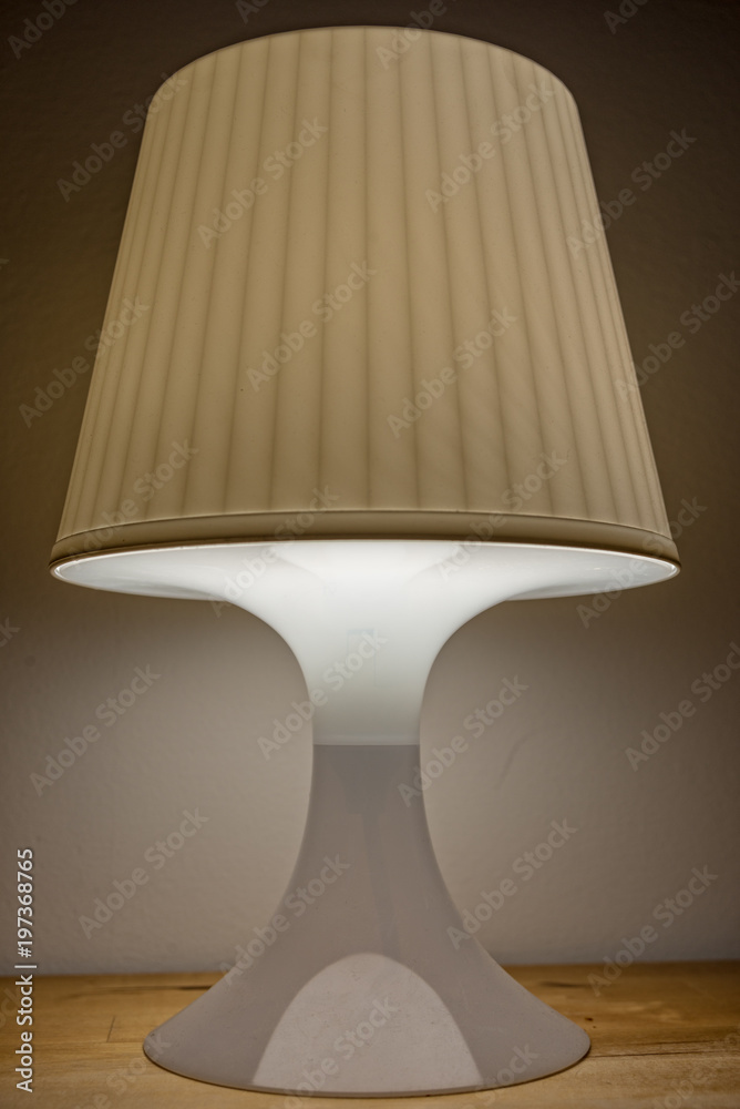 A Turn on bedside lamp is on the table A Turn on bedside lamp is on the table
