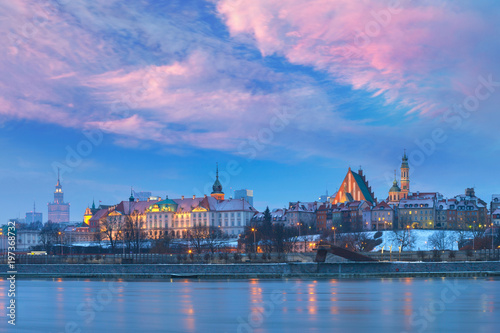 Panorama of the Old Town with reflection in the Vistula River at sunset, Warsaw, Poland.