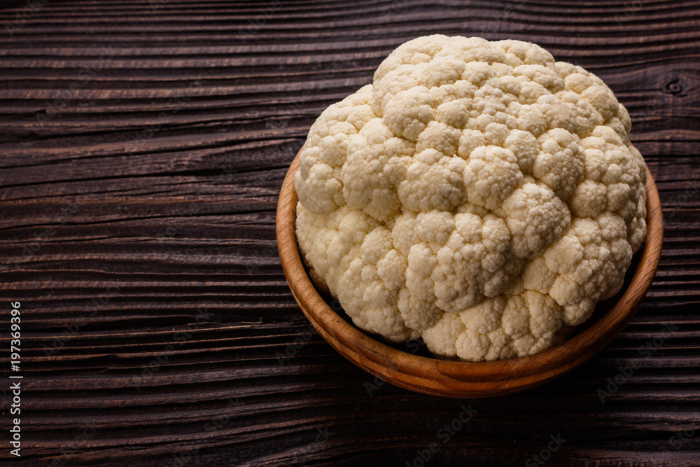 fresh cauliflower on a rustic wooden background fresh cauliflower on a rustic wooden background