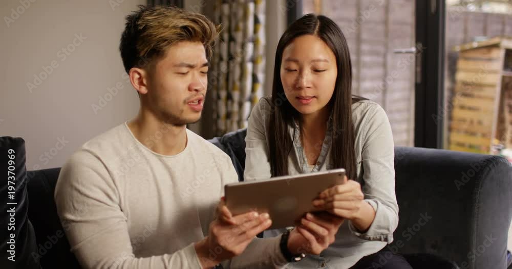 4K Bossy girlfriend snatching computer tablet from her boyfriend at home 4K Bossy girlfriend snatching computer tablet from her boyfriend at home