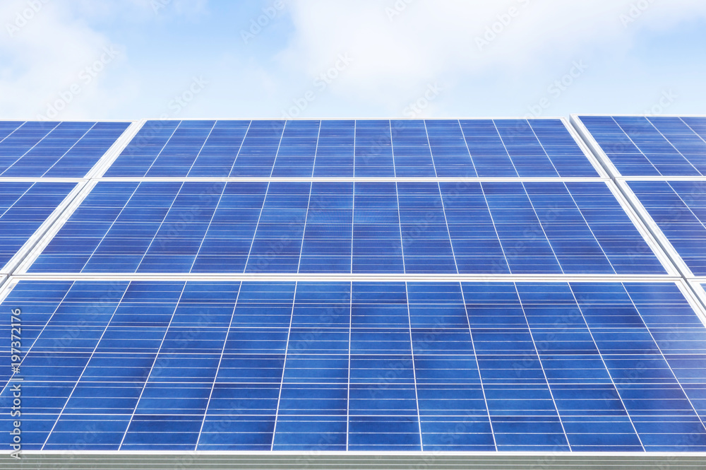 Close up rows array of polycrystalline silicon solar cells or photovoltaics in solar power plant alternative turn up skyward absorb the sunlight from the sun alternative renewable energy on blue sky Close up rows array of polycrystalline silicon solar cells or photovoltaics in solar power plant alternative turn up skyward absorb the sunlight from the sun alternative renewable energy on blue sky