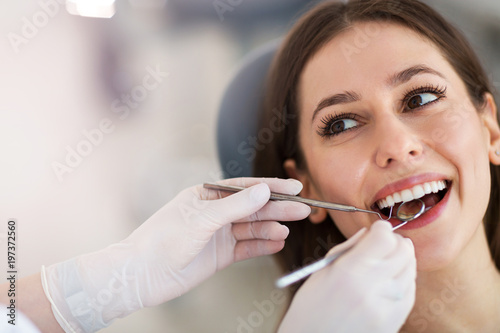 Woman having teeth examined at dentists
