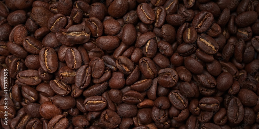 Obraz premium roasted coffee beans macro background