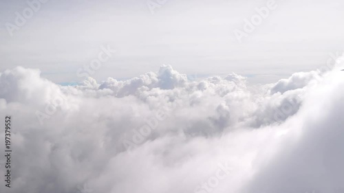 Aerial shot above the clouds in 4K