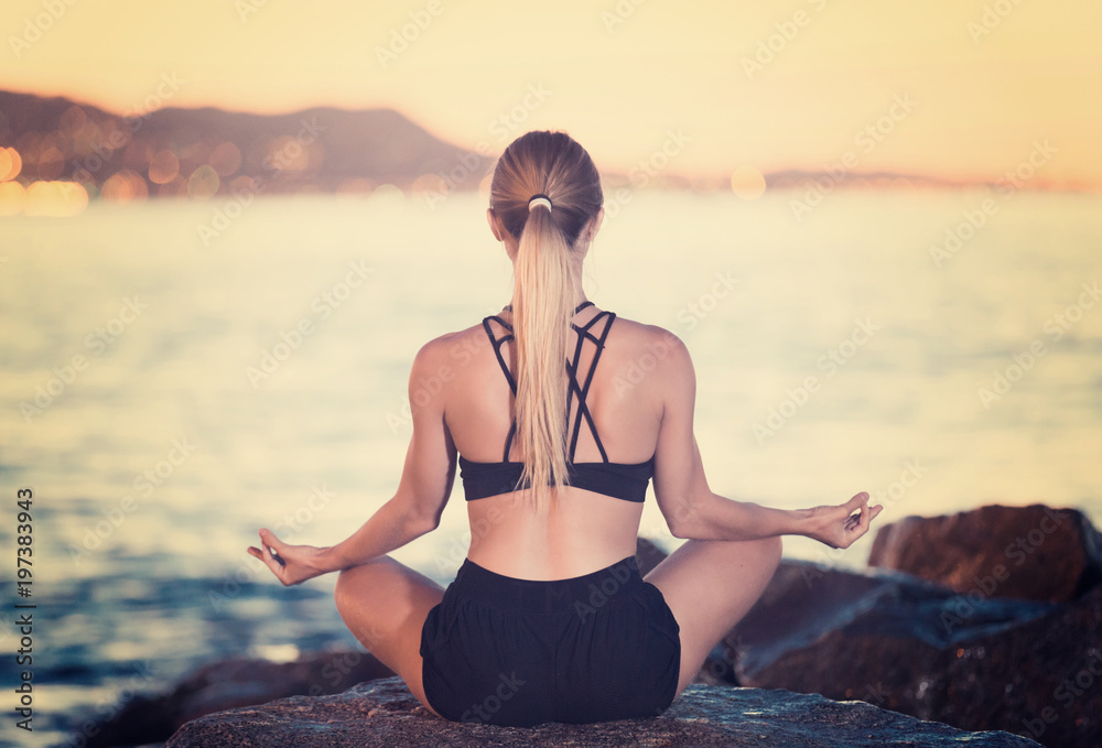Young woman is meditating