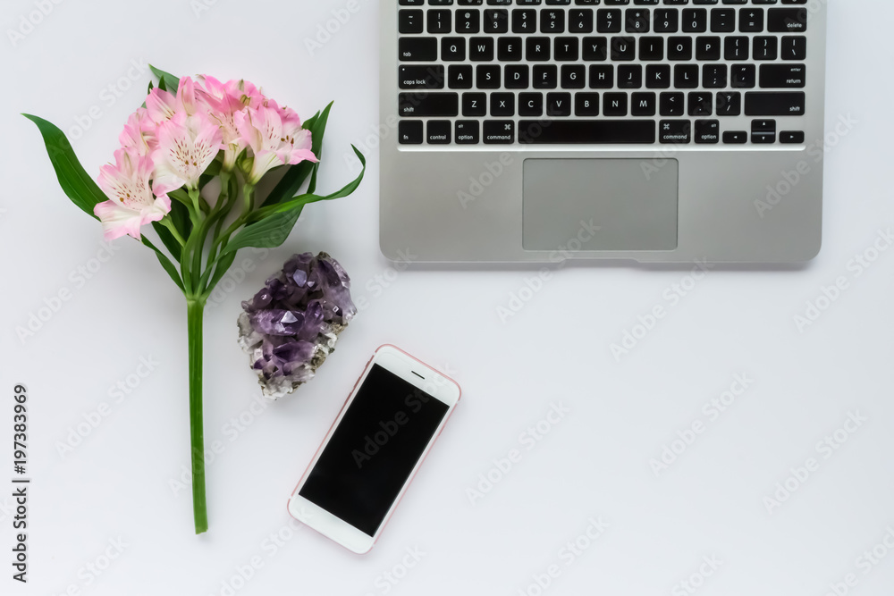 Keyboard, Mobile Phone, Flowers and Amethyst Crystal on White Background with Blank Space Keyboard, Mobile Phone, Flowers and Amethyst Crystal on White Background with Blank Space