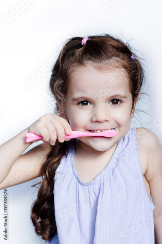 Little kid girl cleaning te...