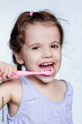 Adorable child girl cleanin...