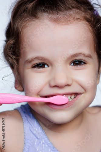 Adorable child girl cleanin...