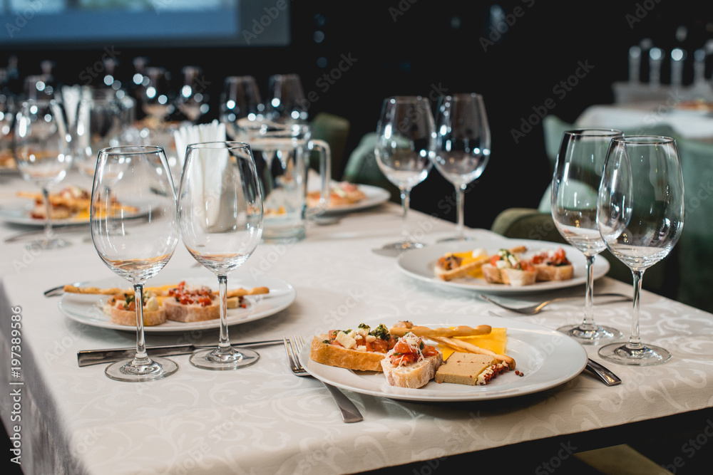 Table served for a wine tasting. Snacks with Pasta, Cheese, Vegetables. Spain tapas recipe food pintxos. Served dish for food and wine tasting