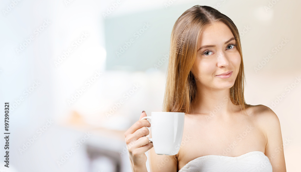 Woman holding a cup of coffee Woman holding a cup of coffee