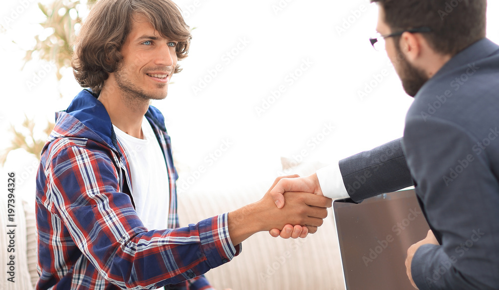 manager shakes hands with his client