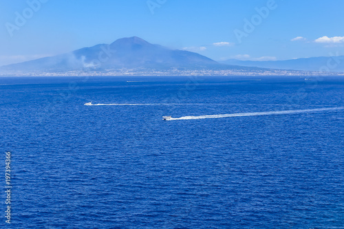 Boat in front of Mount Vesuvius in Bay of Naples at Sorrento resort town