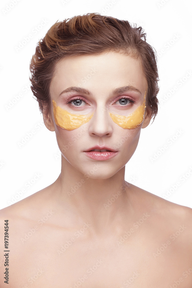 portrait of a girl with a cosmetic beauty  mask on her face..