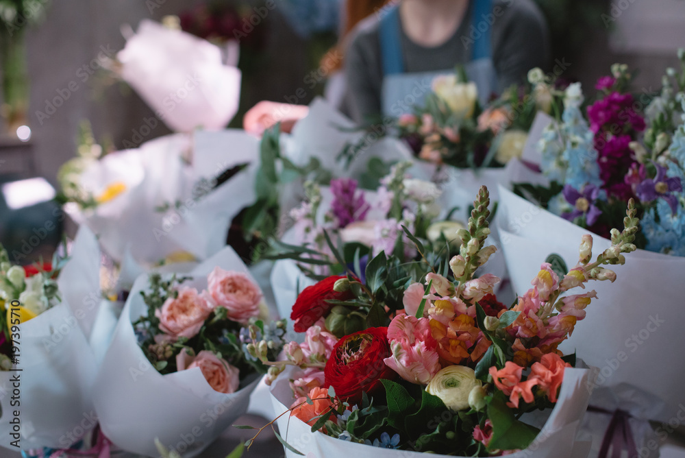 A large number of different flowers in the flower market