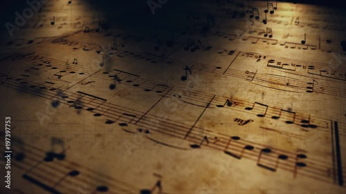 Atmospheric music background with notes on old brown paper photo
