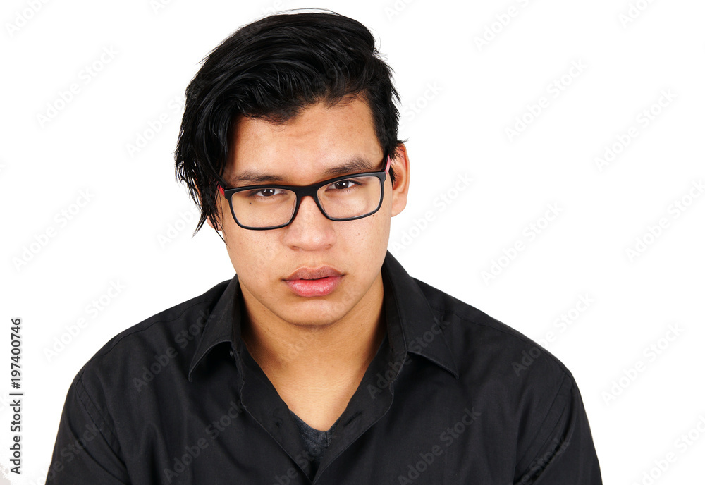 Serious young hispanic man with glasses