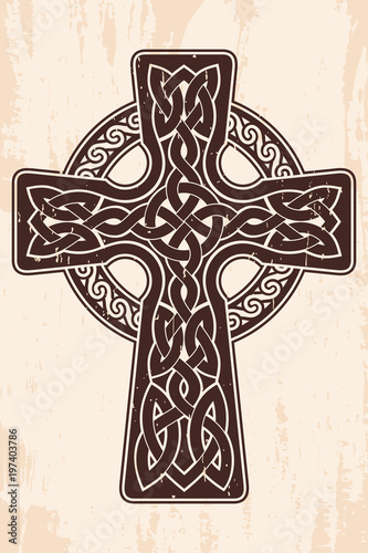 Celtic cross with national ornament as interlaced ribbon. Old brown background with the aging effect.