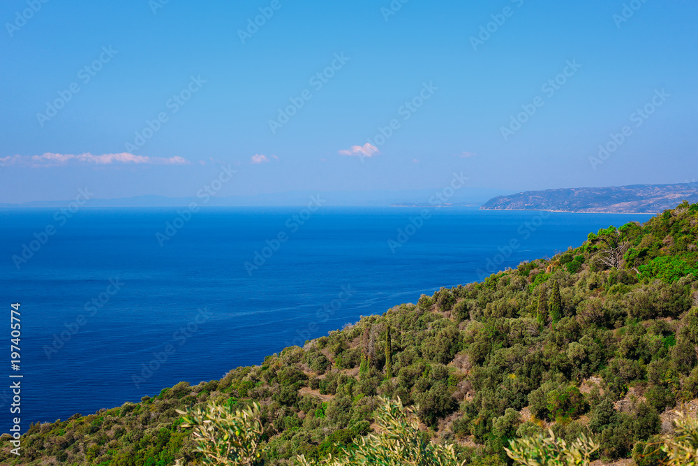 a view of the mountains and the Mediterranean Sea on a sunny summer day. Greece, travel.